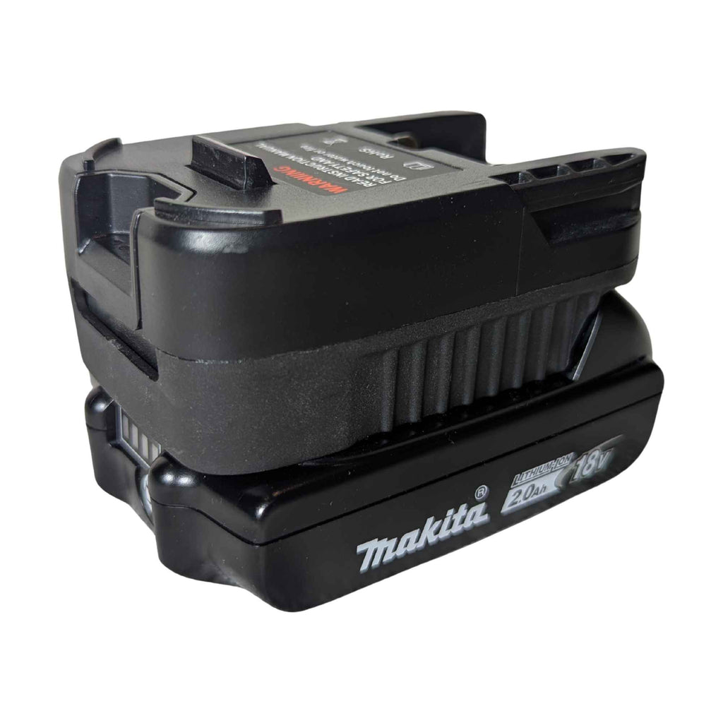 Makita 18V LXT to RIDGID 18V battery adapter - fitted to the Makita 18V LXT battery, vent ribs and warning label in view